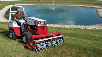 Ventrac tractor with aeravator attachment