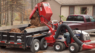 Ventrac collection system using high lift mechanism to dump debris