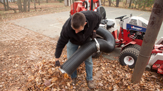 Ventrac collection system hose used as manual leaf vacuum. Click for details.