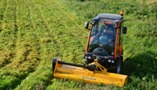 Holder tractor with flail mower cuts large field. Click image for details.