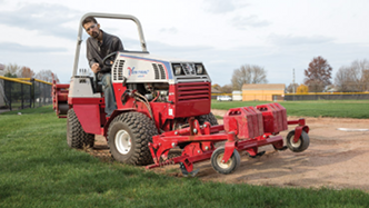 Edging the in-field with Ventrac's baseball field renovator. Click for more detail.