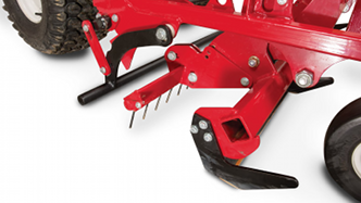 Close-up of edger and weed cutter on Ventrac baseball field renovator. Click for more detail.