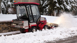 Ventrac 4500 Winter ready featuring the HB580 Broom, SA250 Spreader, and KW452 Cab with Heat