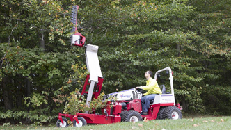 The Ventrac boom mower extends vertically more than 11 feet from the ground
