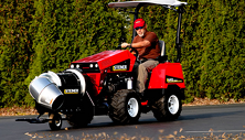 Steiner compact tractor clearing leaves with Turbine Power Blower