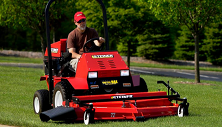 Steiner compact tractor mowing with side discharge mower