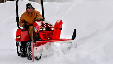Steiner compact tractor with snow blower attachment