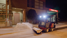 Ventrac 3400 sweeps snow in front of hospital. Click image for broom specs.